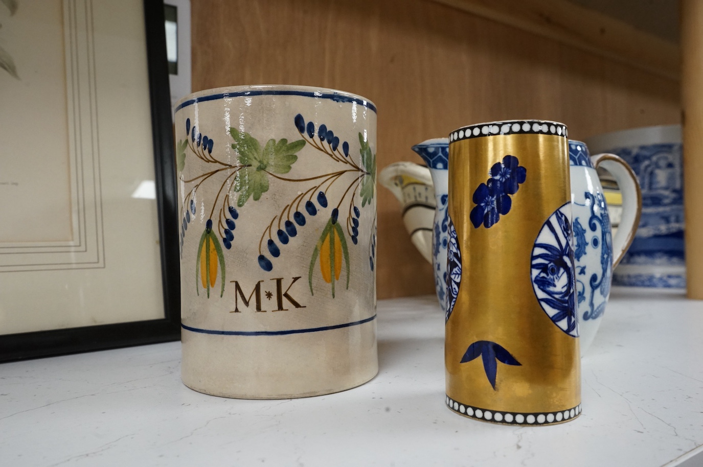 A George III creamware basket, a pearlware mug and jug, a Coalport spill vase (four), basket 26.5cm handle to handle.